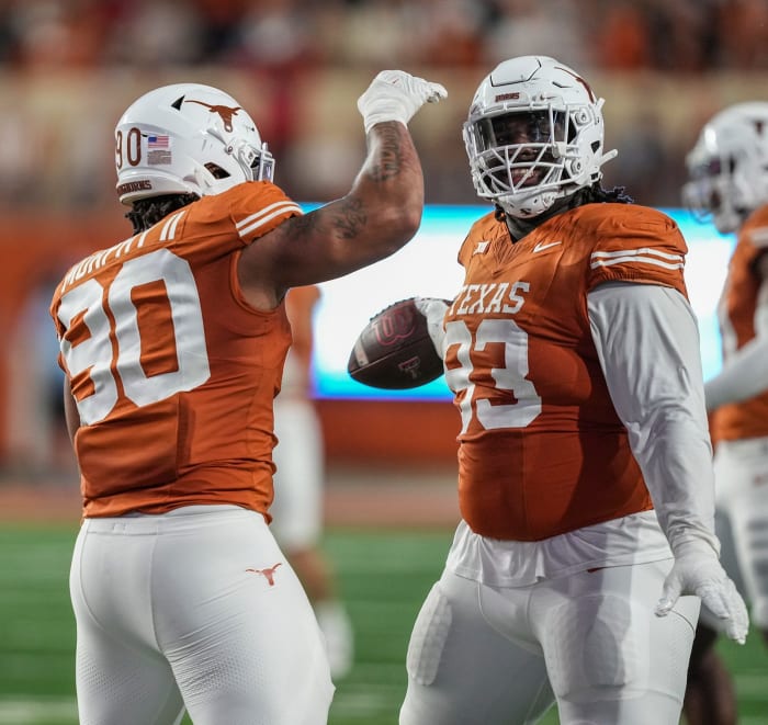 Texas Longhorns DT Byron Murphy celebrates with T'Vondre Sweat
